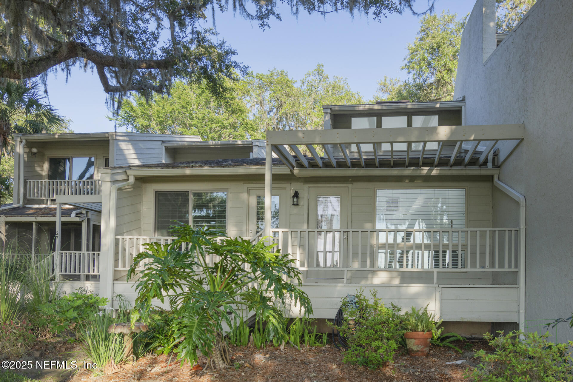 3426 Sea Marsh Road Fernandina Beach, FL 32034 - Photo 6 of 39 a front view of a house with garden