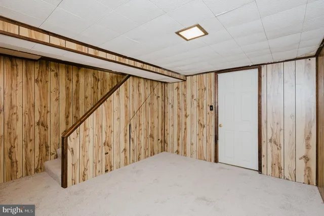a view of an empty room with stairs