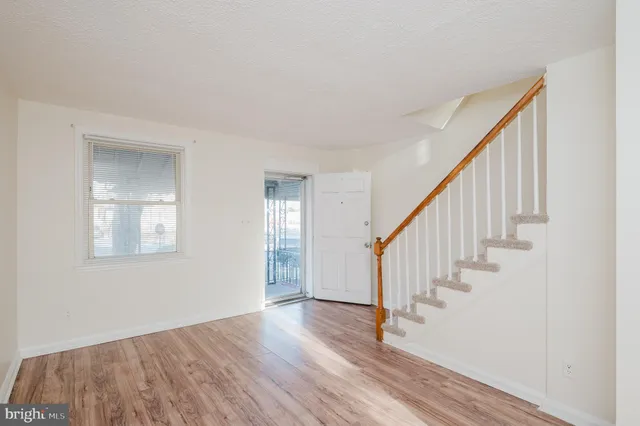 a view of entryway with wooden floor