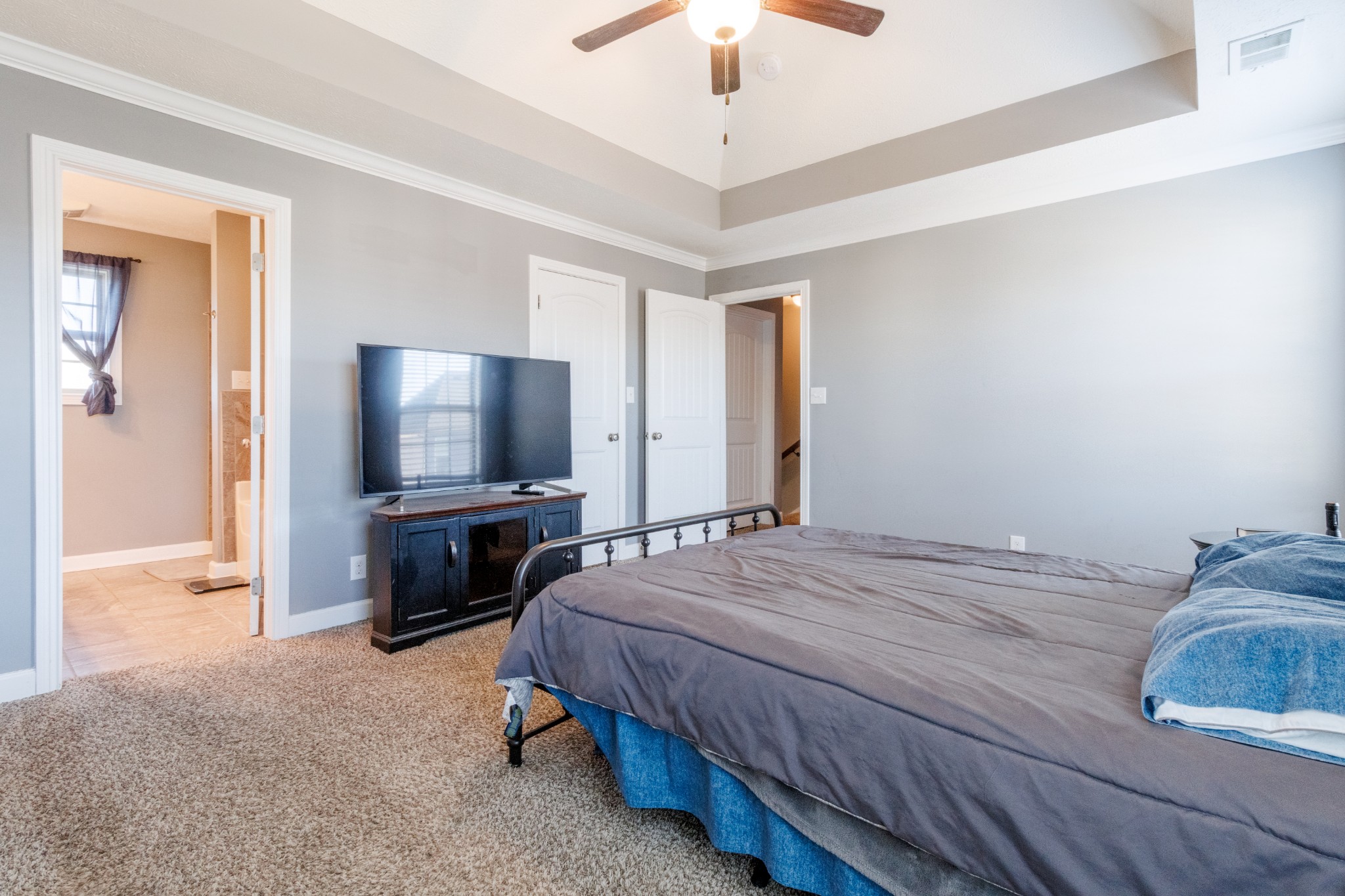 3794 Suiter Road Clarksville, TN 37040 - Photo 13 of 26 a bedroom with a bed and a flat screen tv