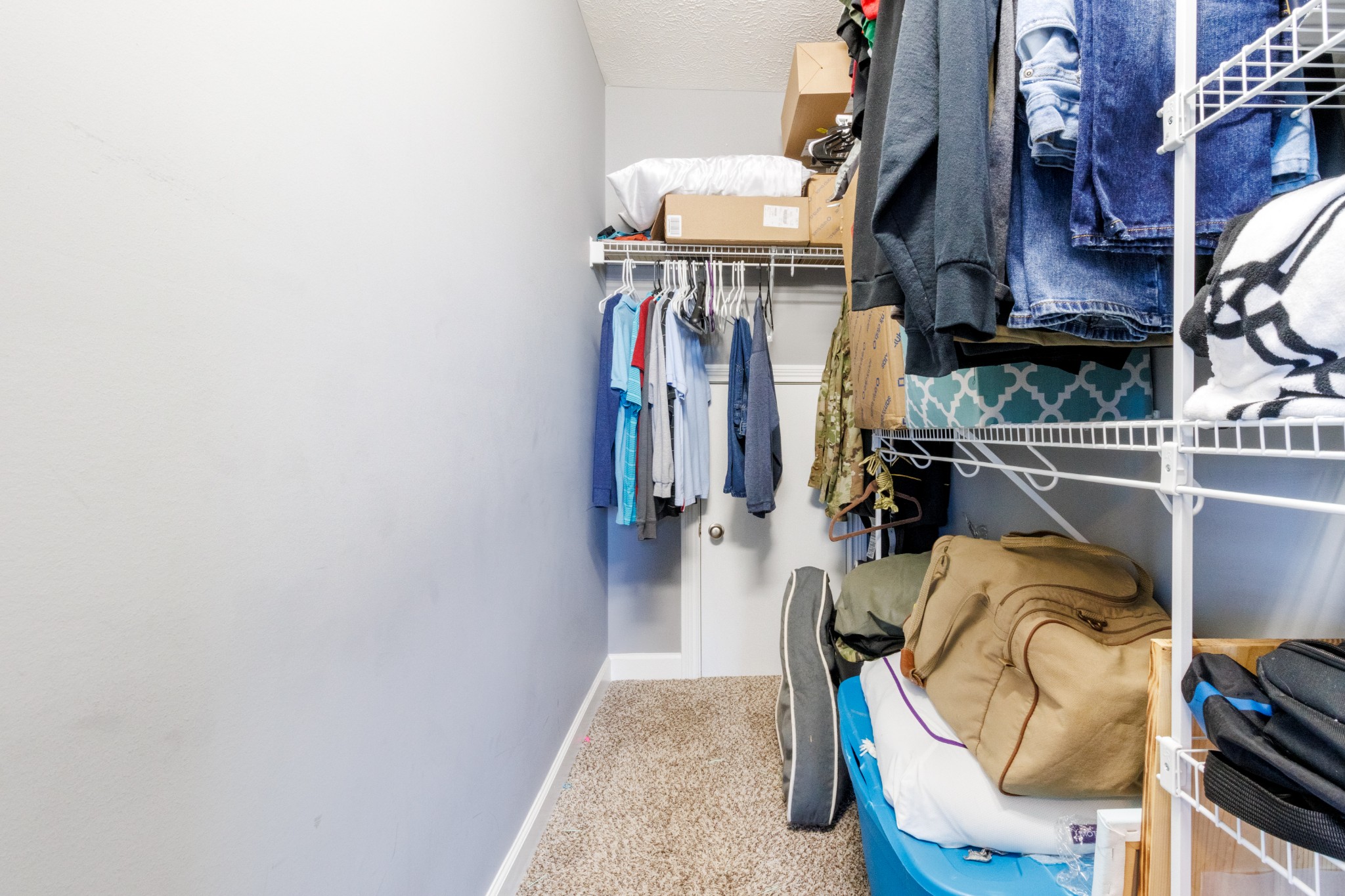 3794 Suiter Road Clarksville, TN 37040 - Photo 16 of 26 a view of walk in closet with clothes and shoes