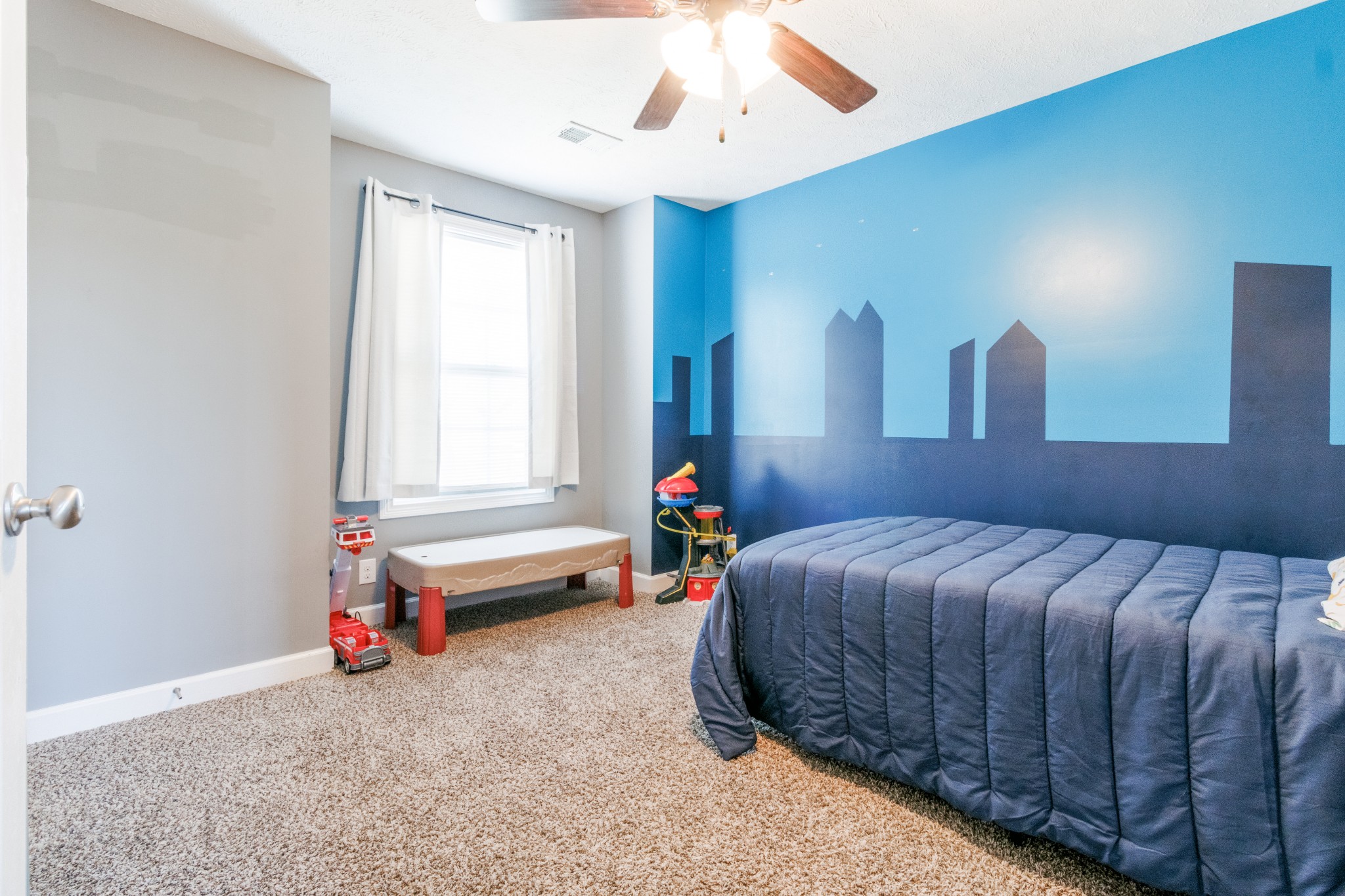 3794 Suiter Road Clarksville, TN 37040 - Photo 17 of 26 a bedroom with a bed and a chandelier