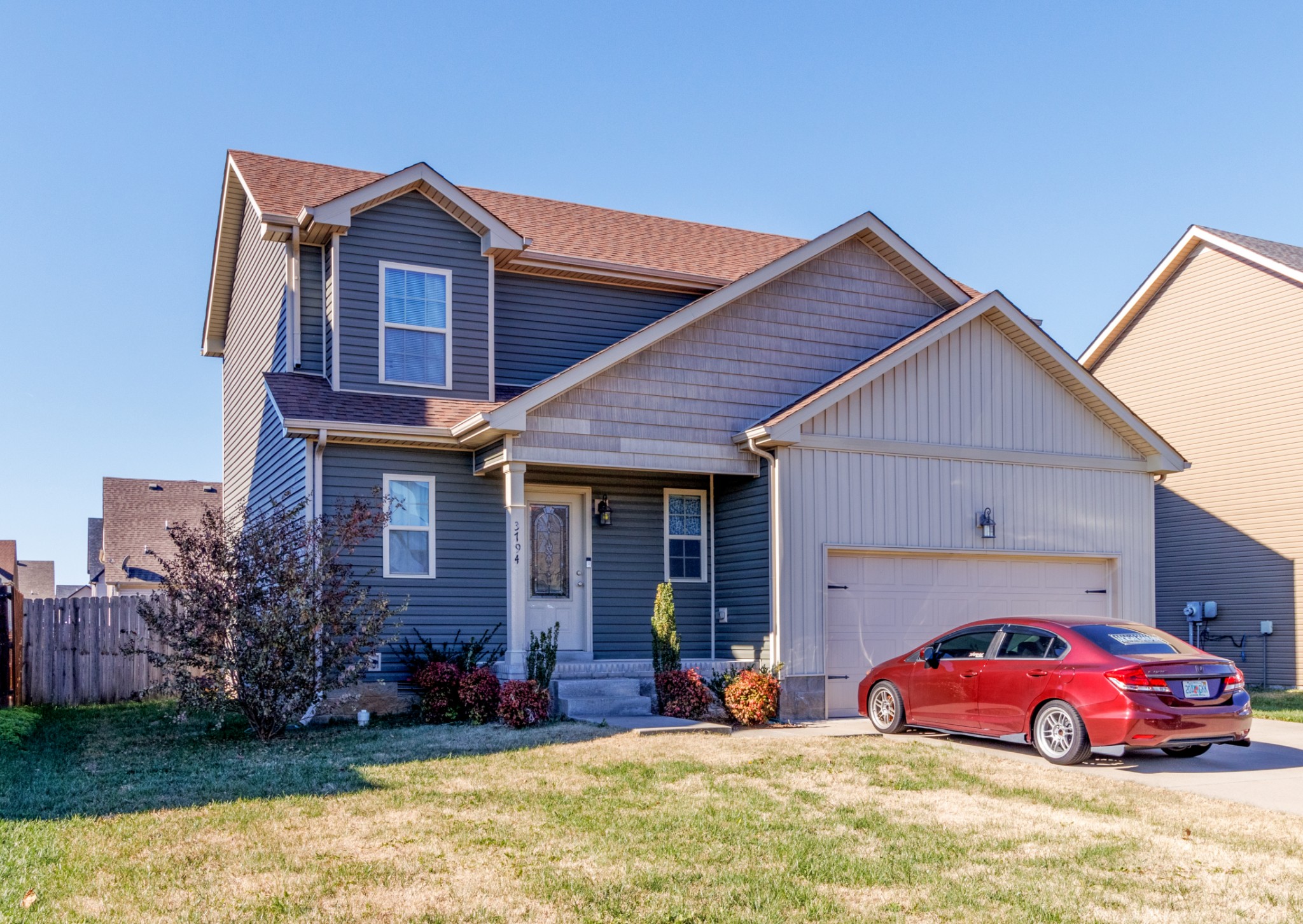 3794 Suiter Road Clarksville, TN 37040 - Photo 2 of 26 a front view of a house with a yard and garage