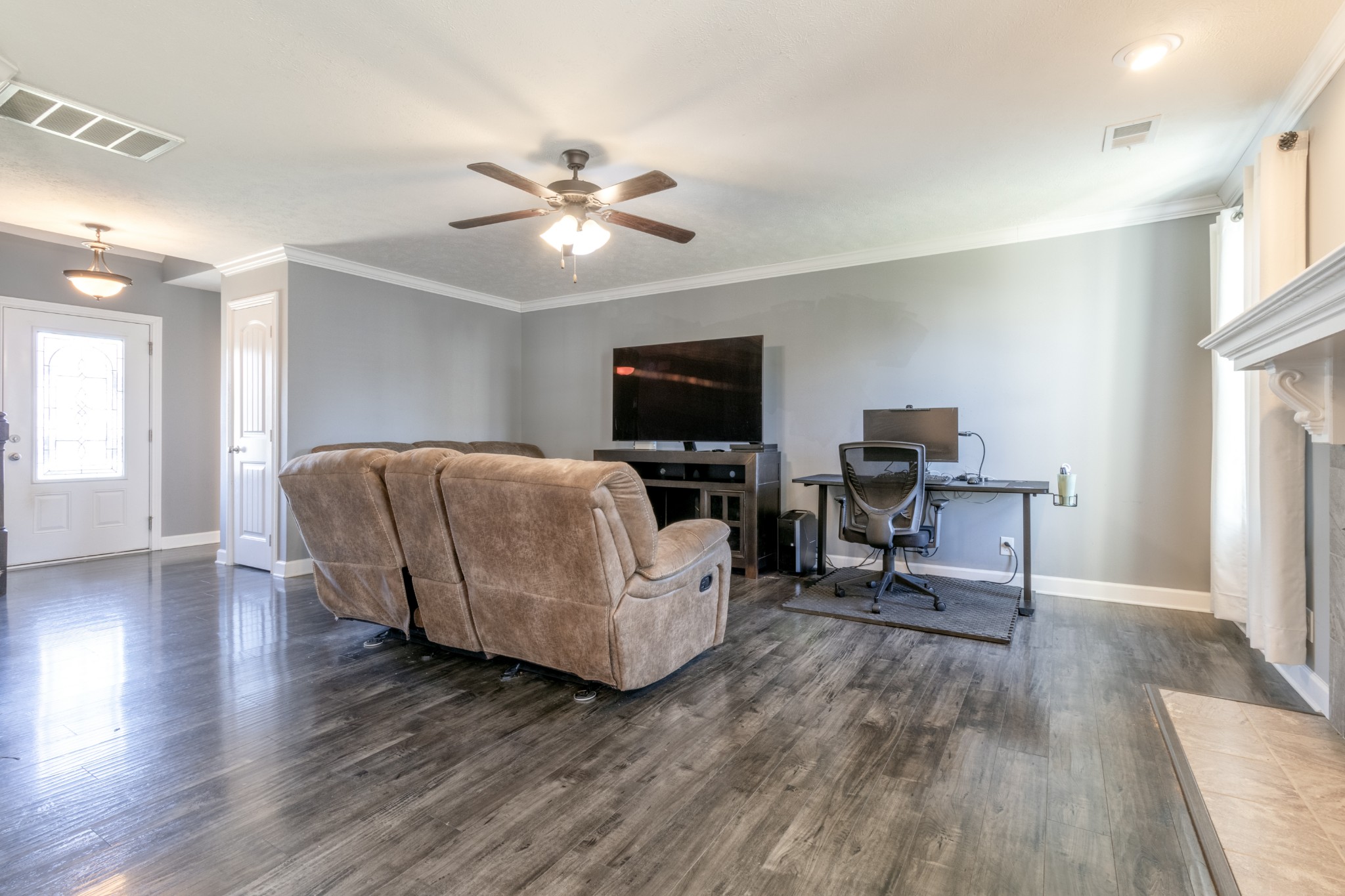 3794 Suiter Road Clarksville, TN 37040 - Photo 6 of 26 a living room with furniture and a flat screen tv