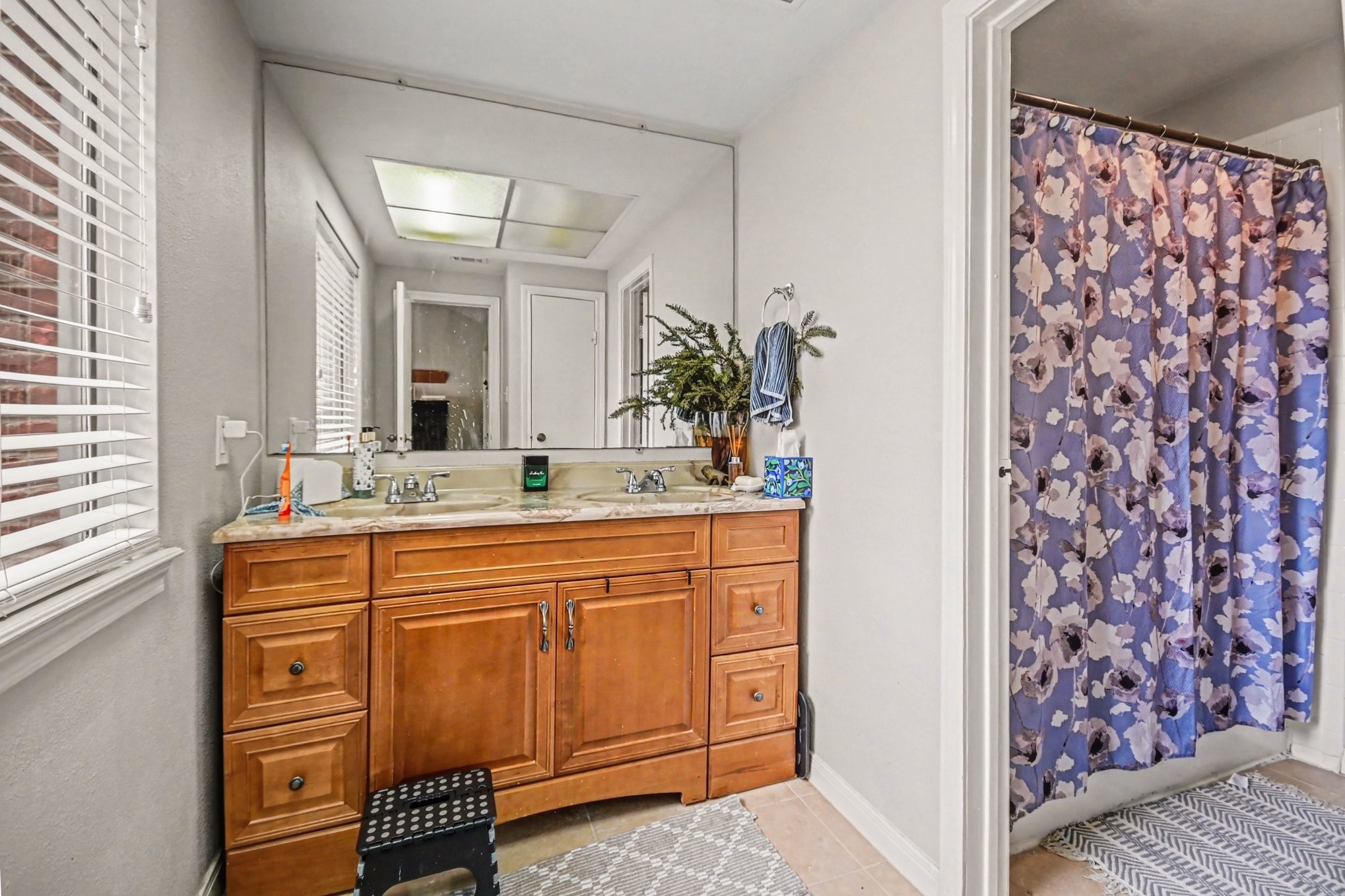 7447 Cambridge Street, Unit 73 Houston, TX 77054 - Photo 19 of 27 a bathroom with a sink and a mirror