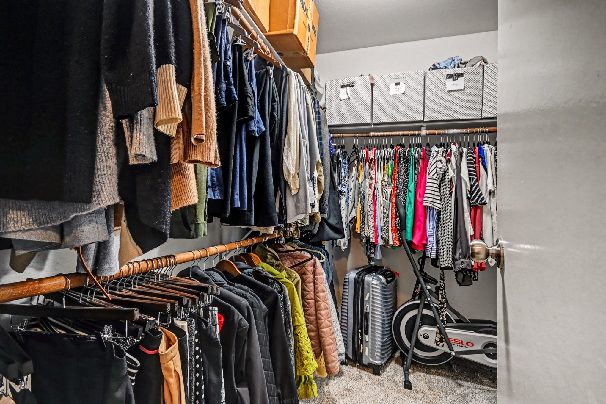 7447 Cambridge Street, Unit 73 Houston, TX 77054 - Photo 21 of 27 a view of walk in closet with clothes