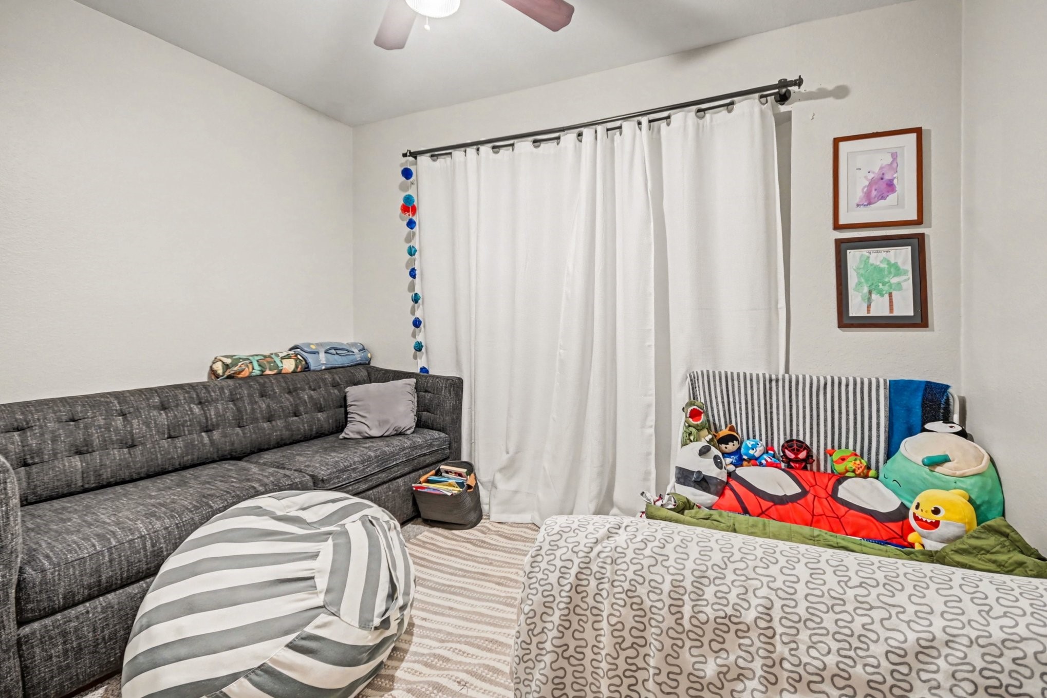 7447 Cambridge Street, Unit 73 Houston, TX 77054 - Photo 23 of 27 a bedroom with furniture and a couch