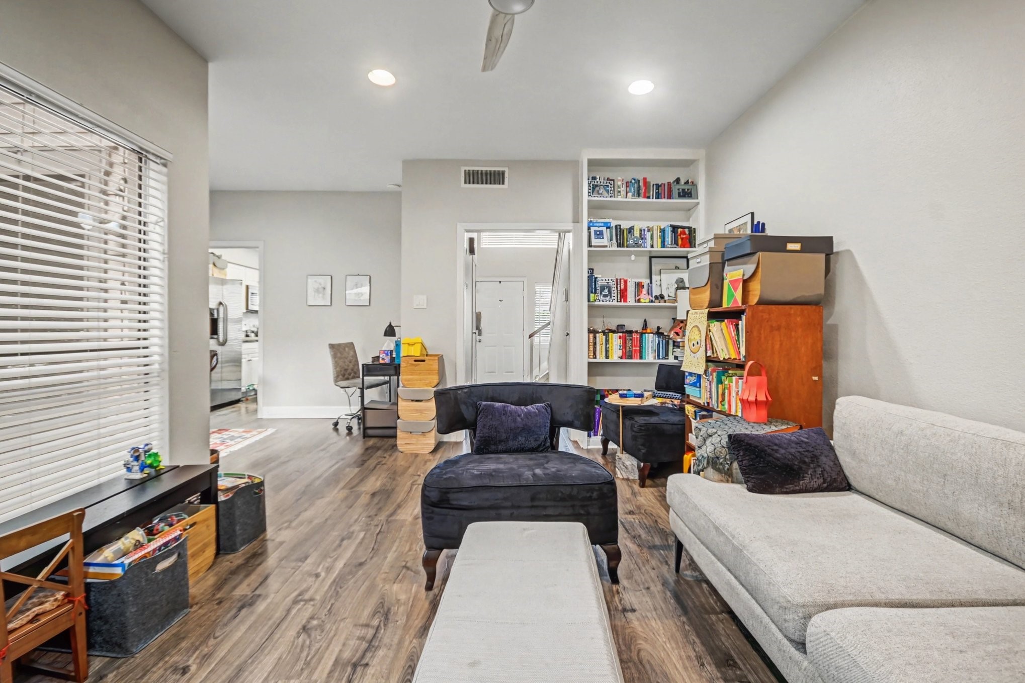7447 Cambridge Street, Unit 73 Houston, TX 77054 - Photo 6 of 27 a living room with furniture and wooden floor
