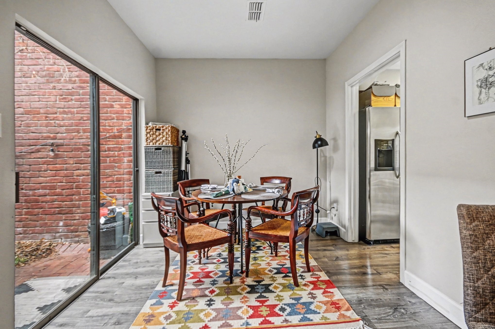 7447 Cambridge Street, Unit 73 Houston, TX 77054 - Photo 9 of 27 a view of a dining room with furniture and wooden floor
