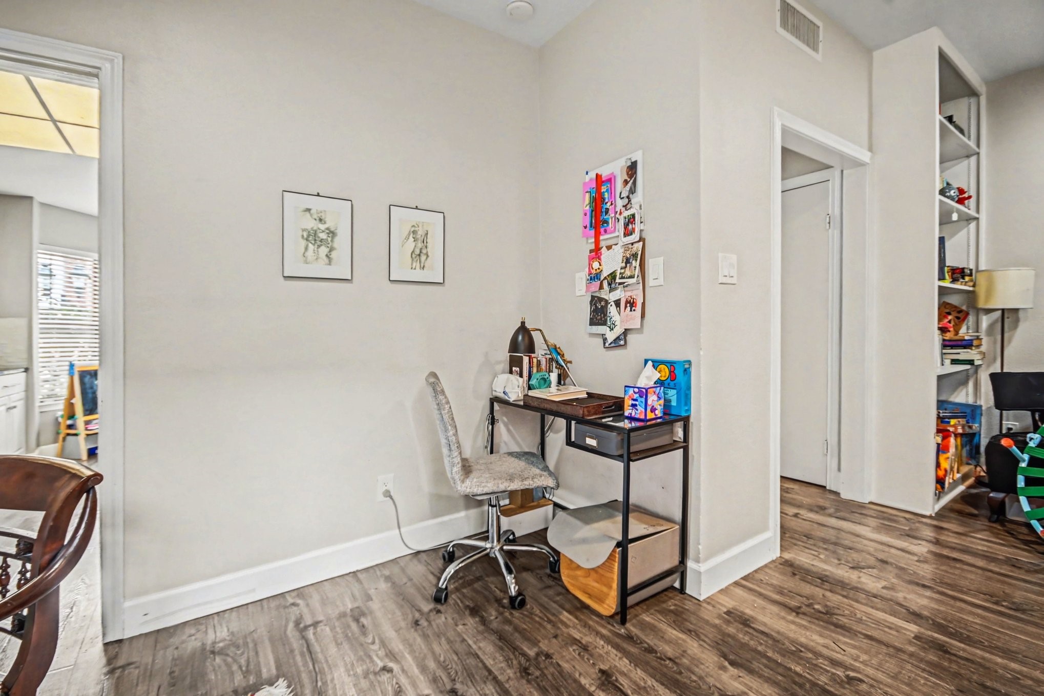 7447 Cambridge Street, Unit 73 Houston, TX 77054 - Photo 10 of 27 a view of a workspace with furniture and wooden floor