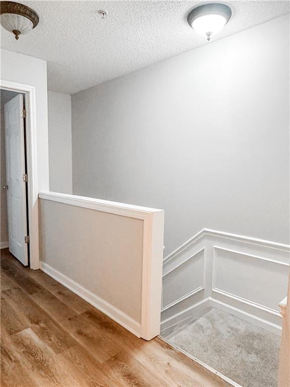 139 Riverstone Commons Circle Canton, GA 30114 - Photo 12 of 28 an empty room with wooden floor