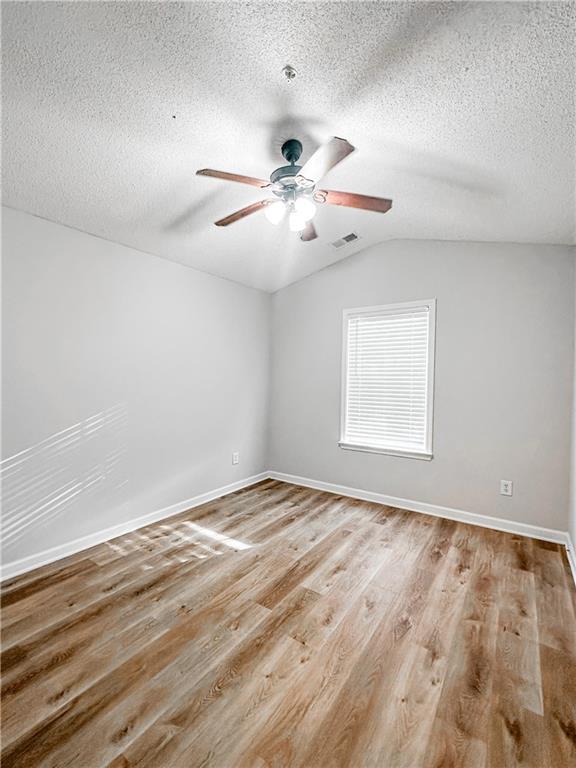 139 Riverstone Commons Circle Canton, GA 30114 - Photo 20 of 28 an empty room with windows and fan