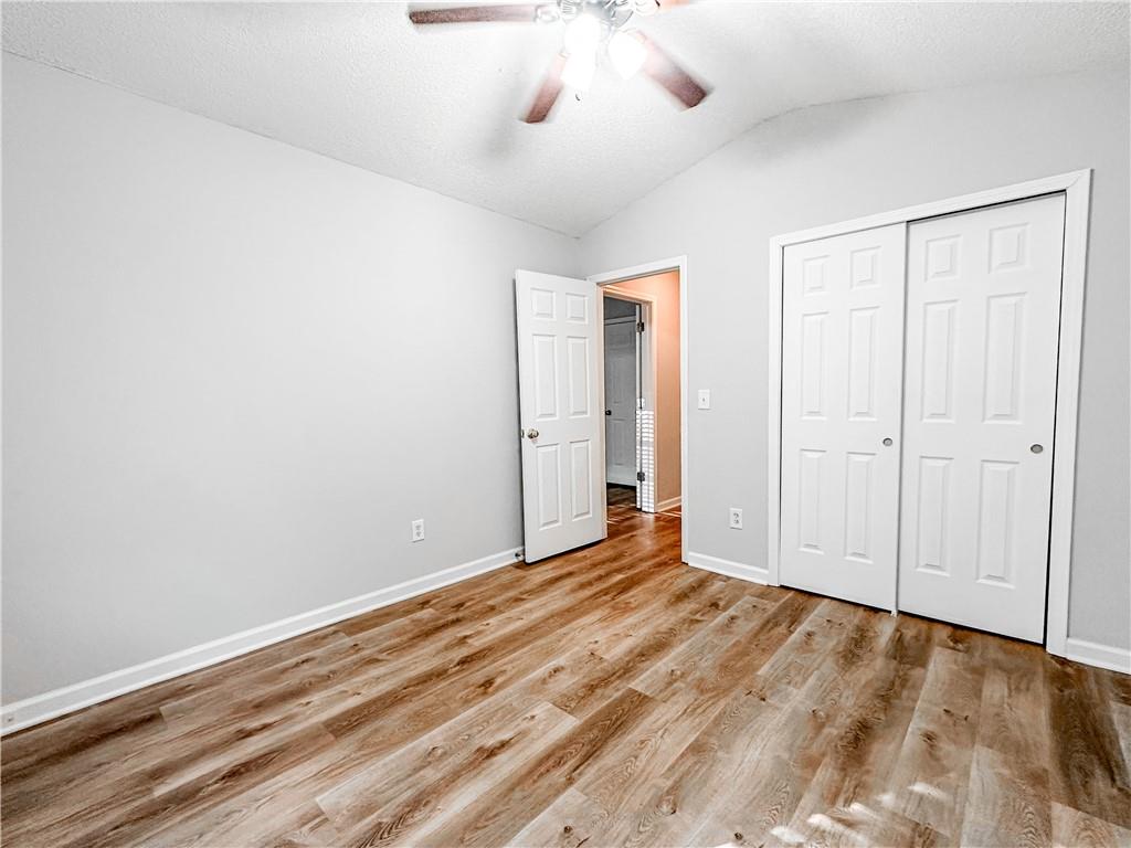 139 Riverstone Commons Circle Canton, GA 30114 - Photo 21 of 28 wooden floor in an empty room