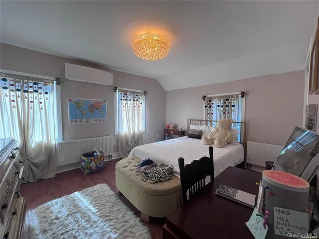 a bed room with a bed and a window