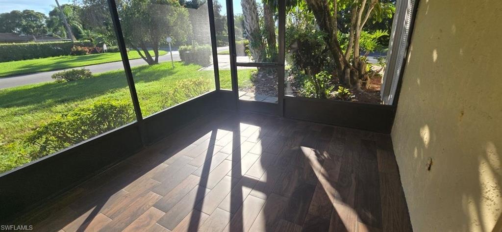 925 Palm View Drive, Unit 121 Naples, FL 34110 - Photo 5 of 13 View of unfurnished sunroom