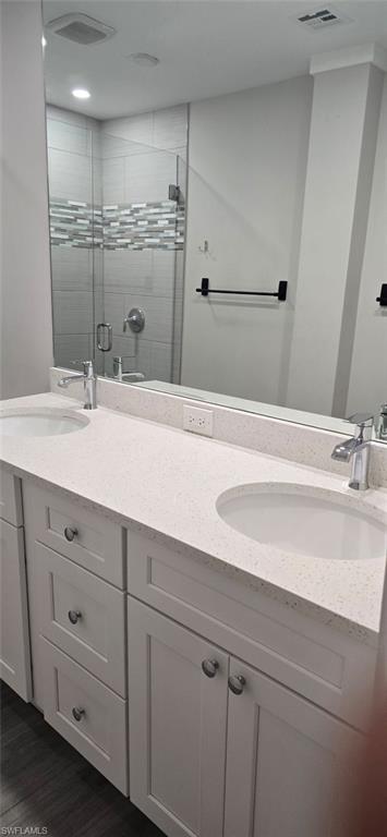 925 Palm View Drive, Unit 121 Naples, FL 34110 - Photo 9 of 13 Full bath featuring double vanity and a stall shower