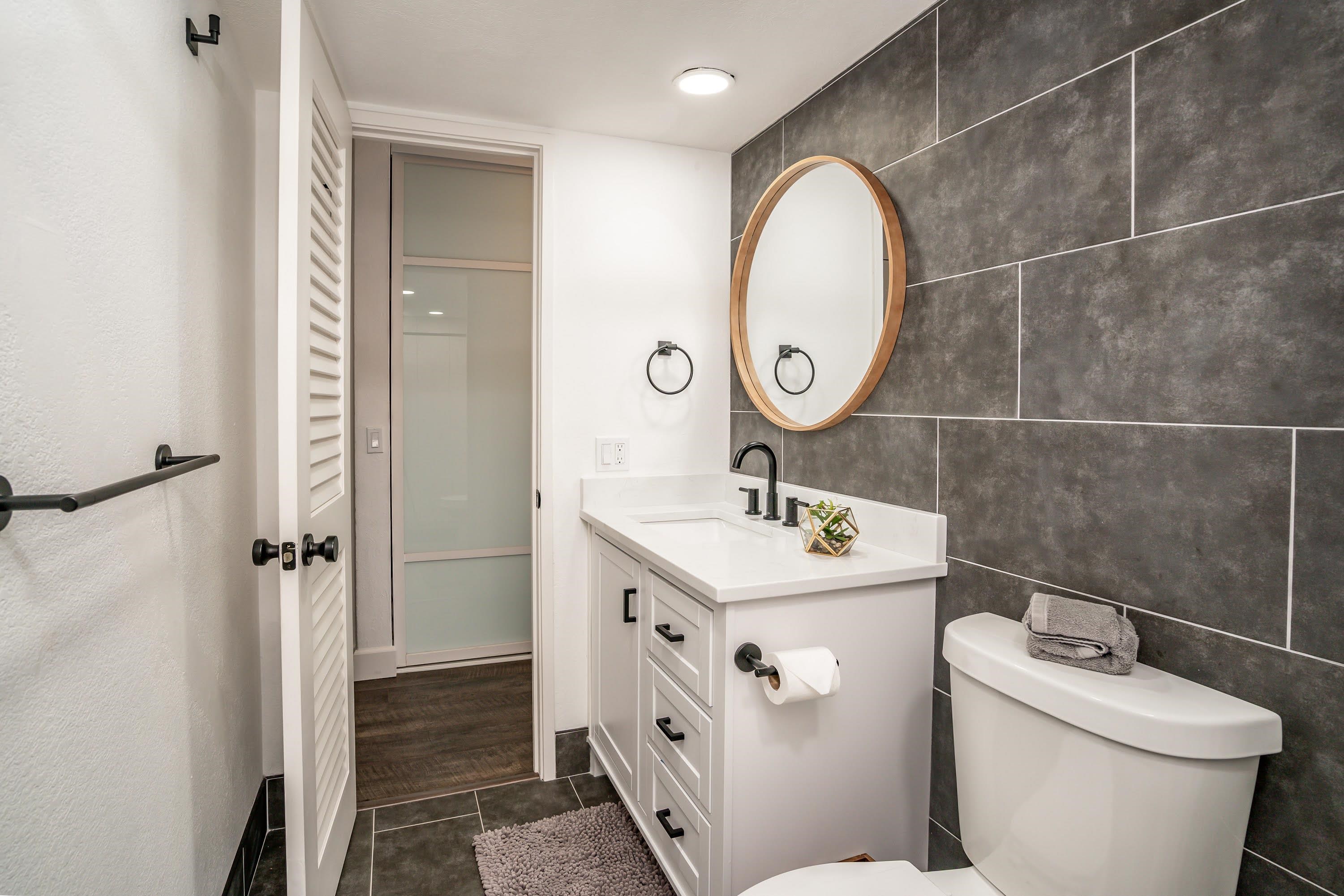 2191 South Kihei Road, Unit 1118 Kihei, HI 96753 - Photo 17 of 40 a bathroom with a sink a toilet and a mirror