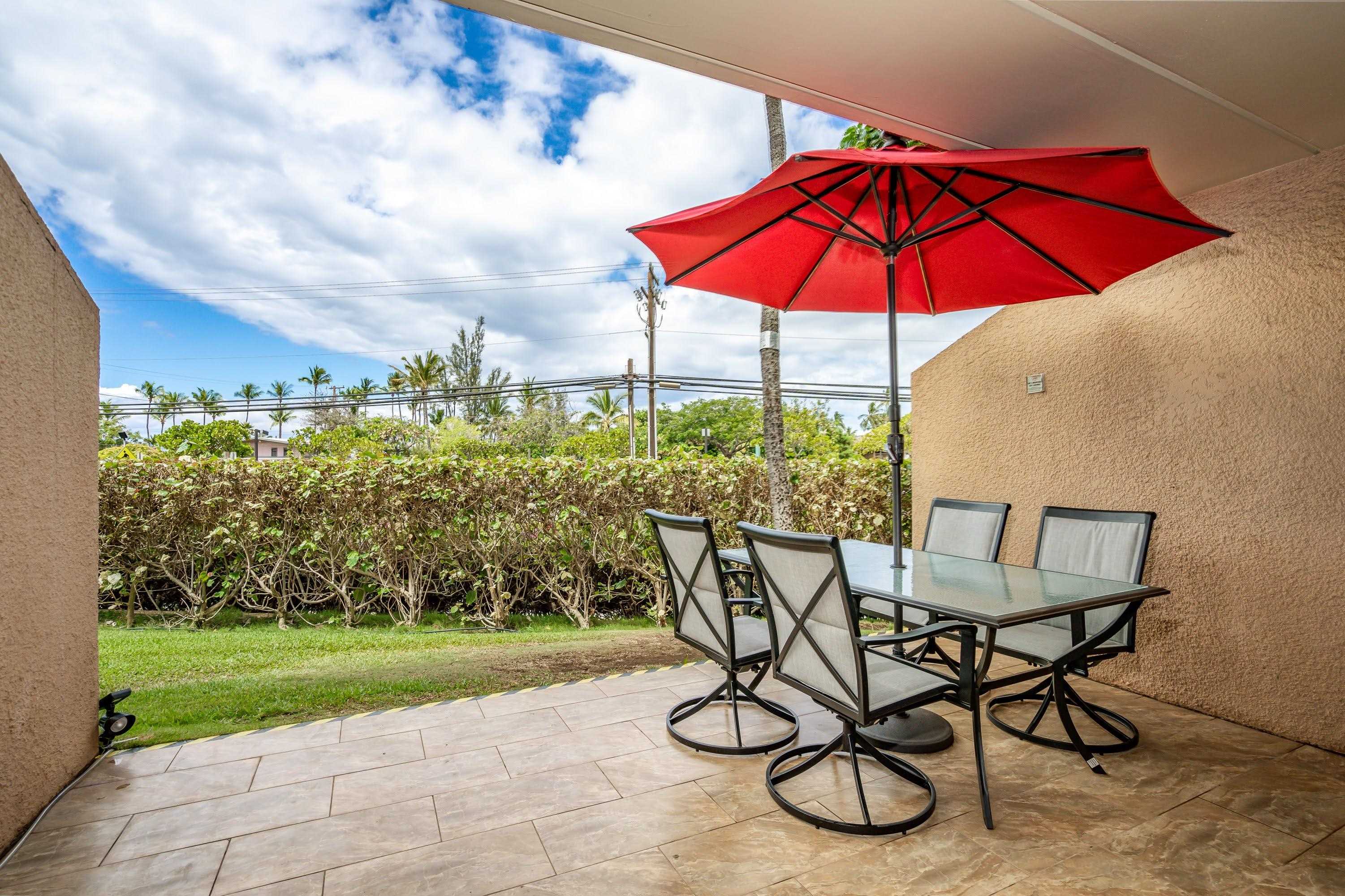 2191 South Kihei Road, Unit 1118 Kihei, HI 96753 - Photo 20 of 40 a view of a table and chairs under an umbrella