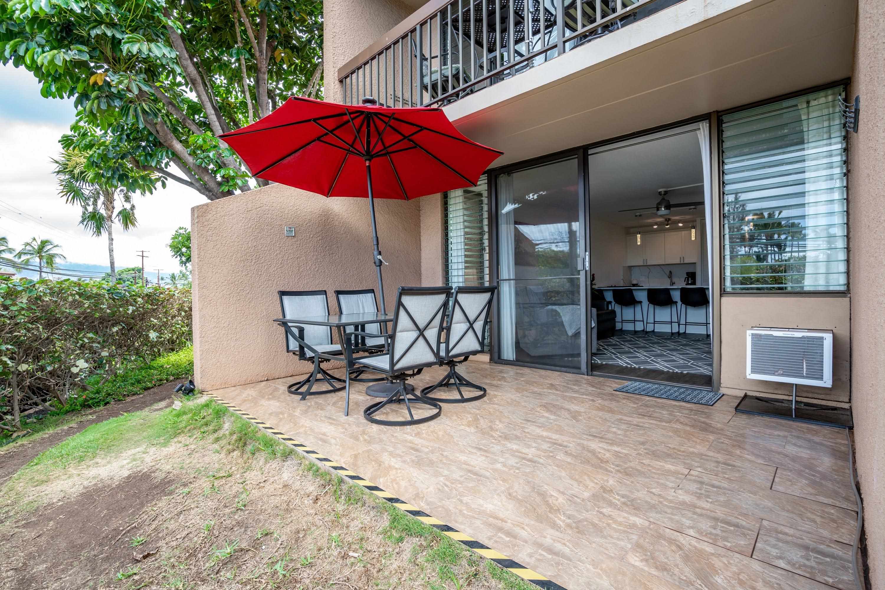 2191 South Kihei Road, Unit 1118 Kihei, HI 96753 - Photo 21 of 40 a view of a backyard with chair and table