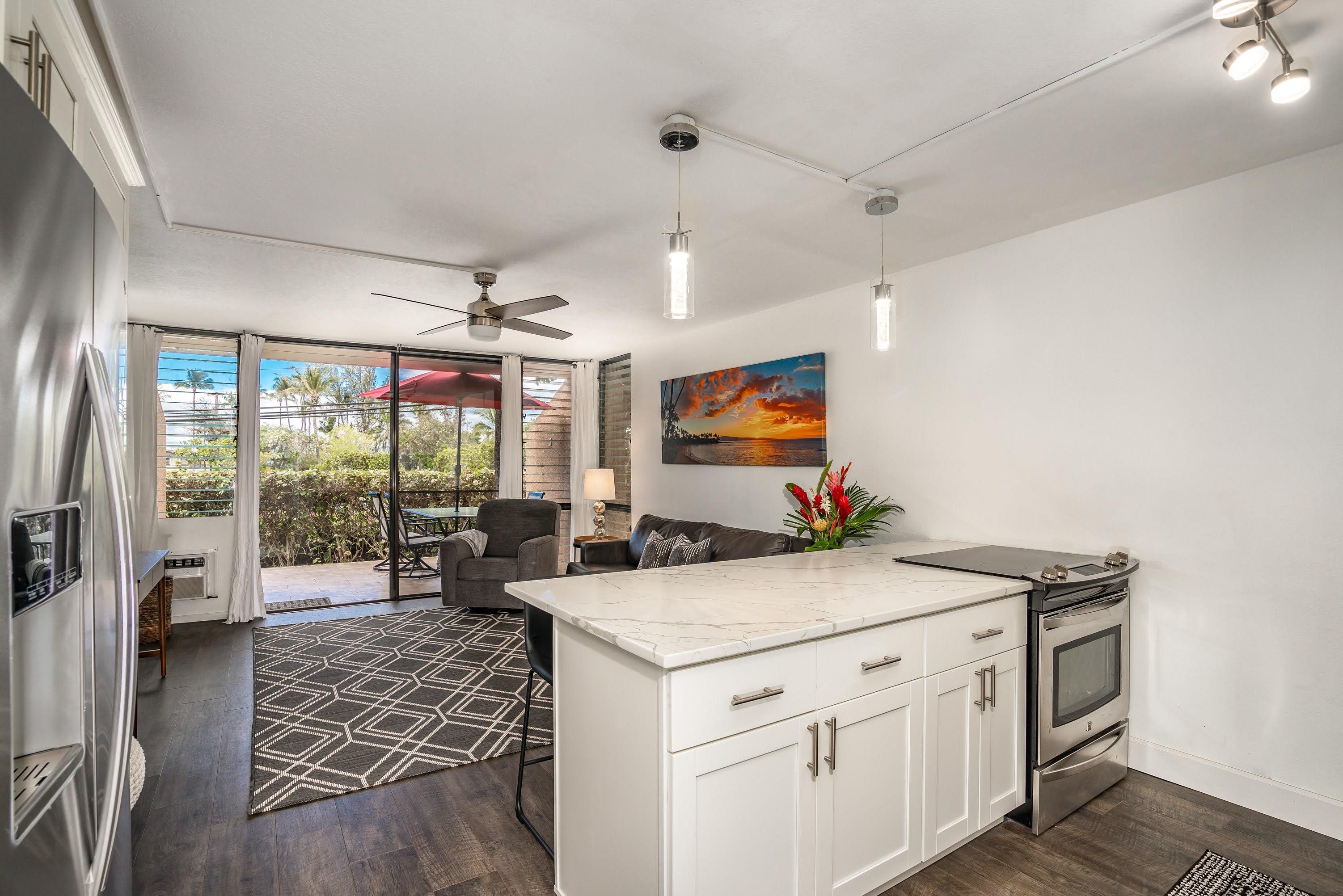 2191 South Kihei Road, Unit 1118 Kihei, HI 96753 - Photo 4 of 40 a view of living room with furniture flat screen tv and floor to ceiling window