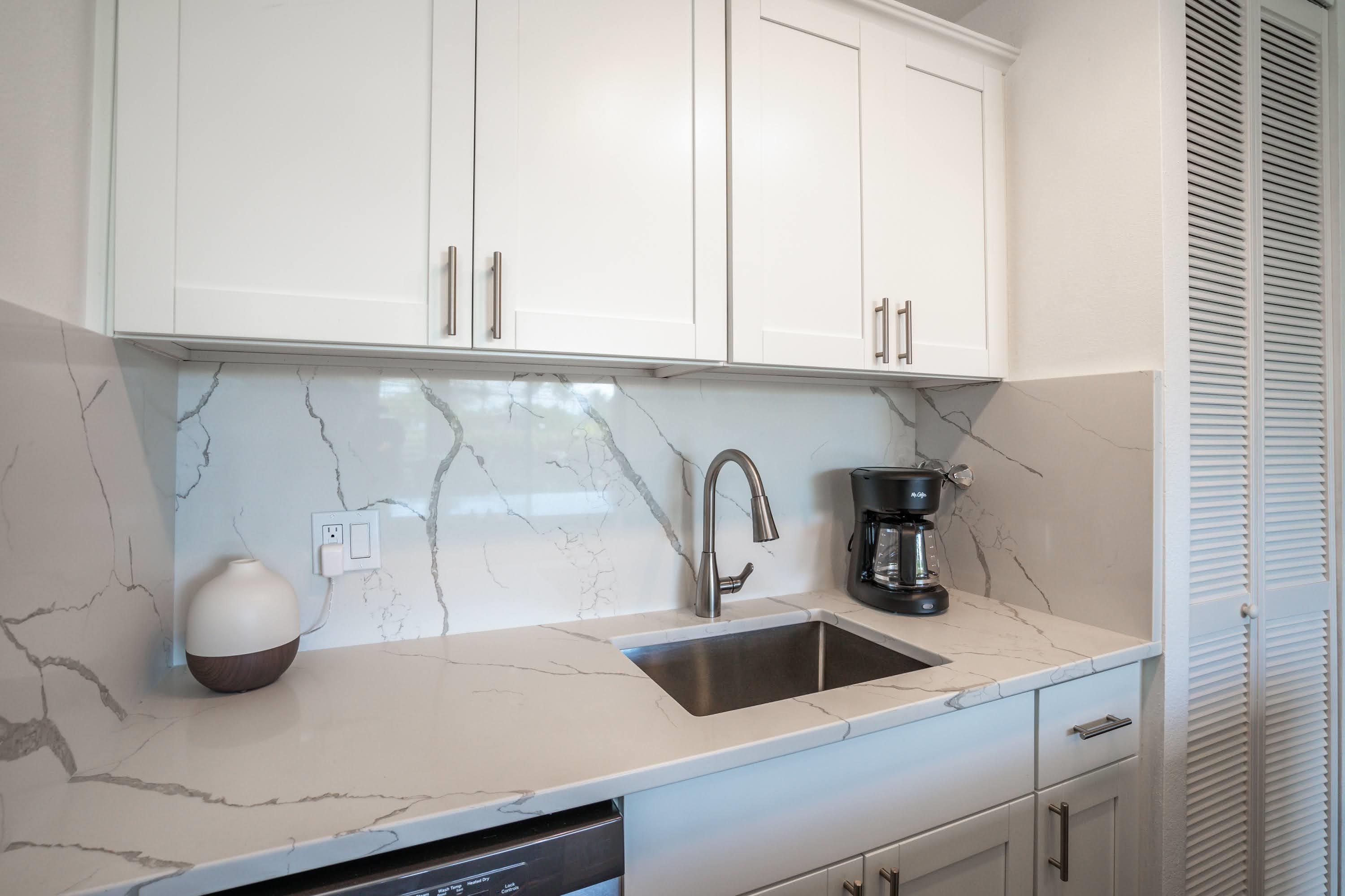 2191 South Kihei Road, Unit 1118 Kihei, HI 96753 - Photo 6 of 40 a kitchen with a sink and a stove