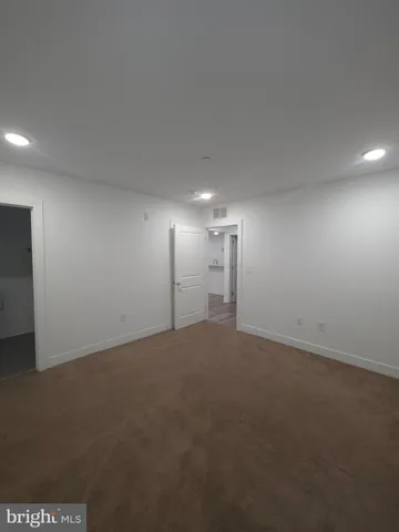 a bathroom with a toilet a sink and shower