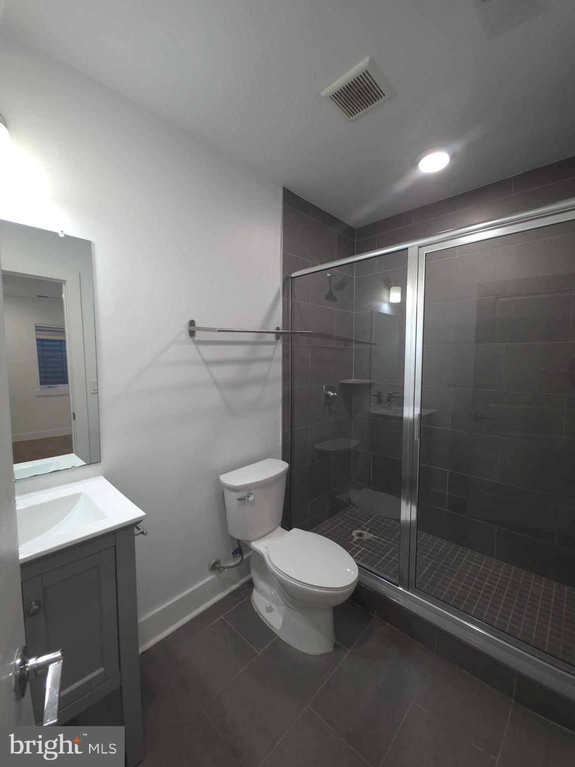 3925 Haverford Avenue, Unit LL6 Philadelphia, PA 19104 - Photo 29 of 36 a bathroom with a toilet a sink and shower