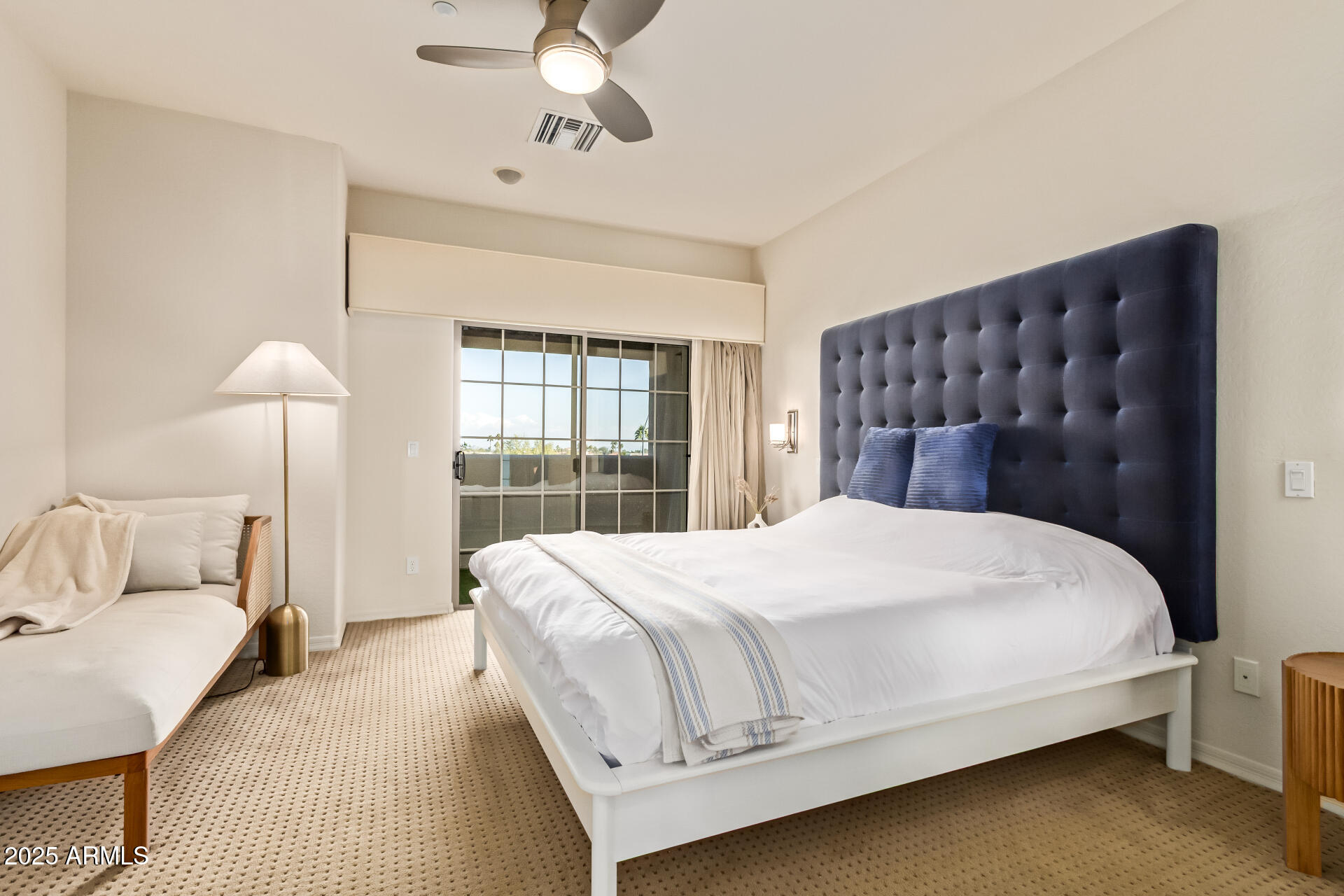 6940 East Cochise Road, Unit 1016 Paradise Valley, AZ 85253 - Photo 12 of 39 a bedroom with a large bed and a window