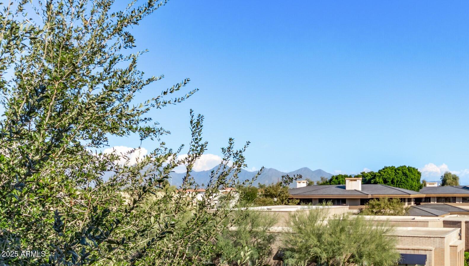 6940 East Cochise Road, Unit 1016 Paradise Valley, AZ 85253 - Photo 18 of 39 a view of a lake with a mountain