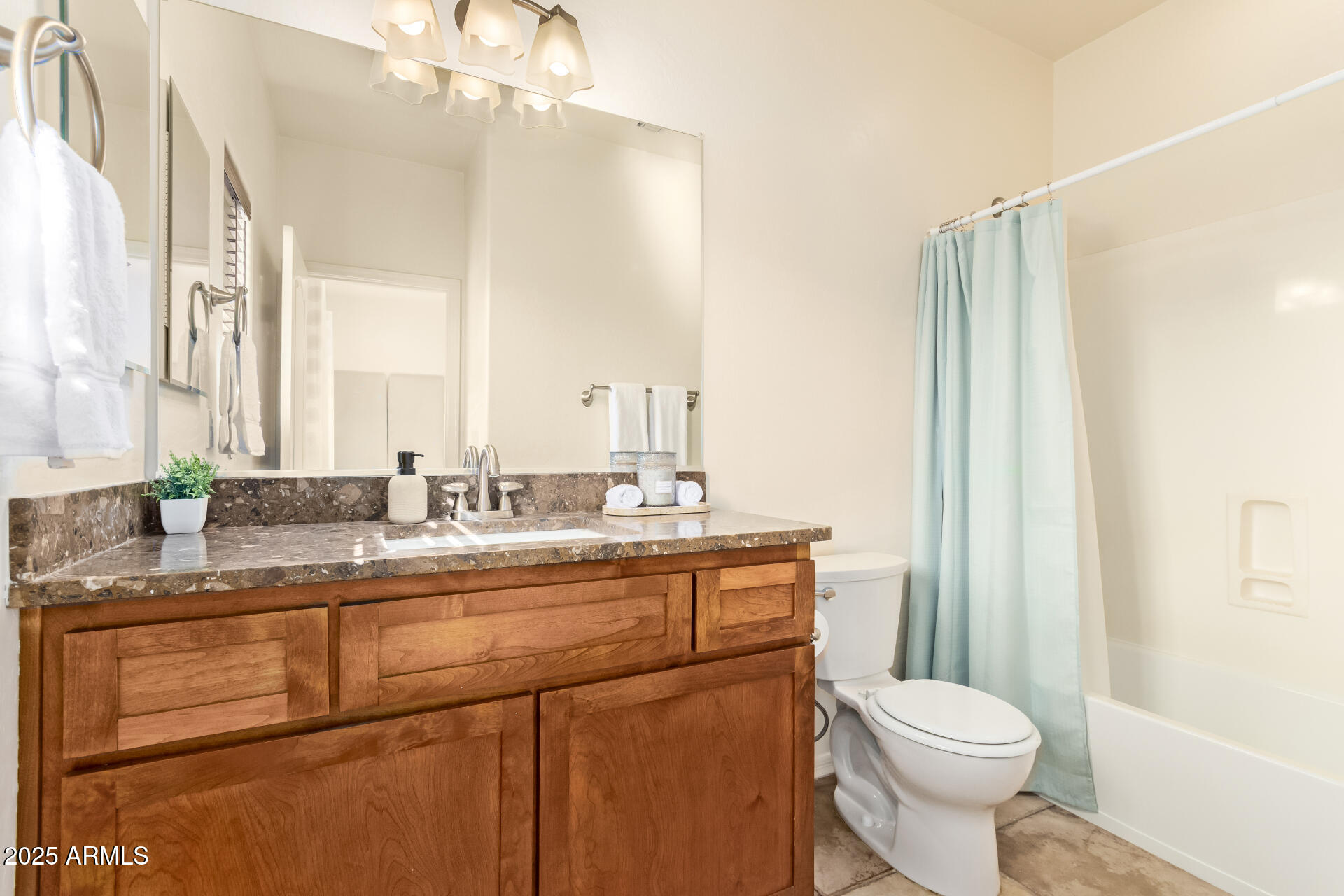 6940 East Cochise Road, Unit 1016 Paradise Valley, AZ 85253 - Photo 21 of 39 a bathroom with a sink a toilet and a mirror