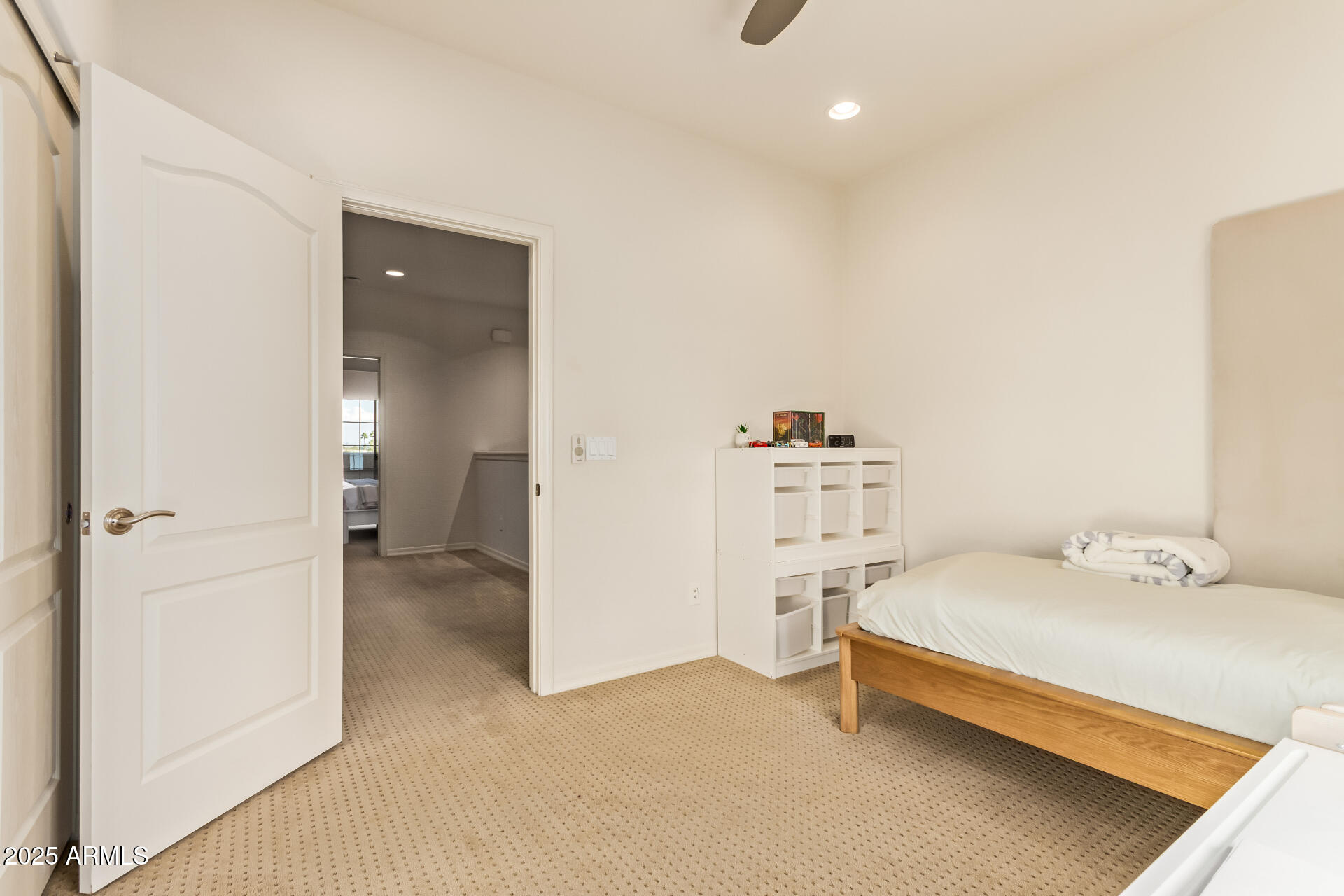 6940 East Cochise Road, Unit 1016 Paradise Valley, AZ 85253 - Photo 22 of 39 a bedroom with a bed and cabinets