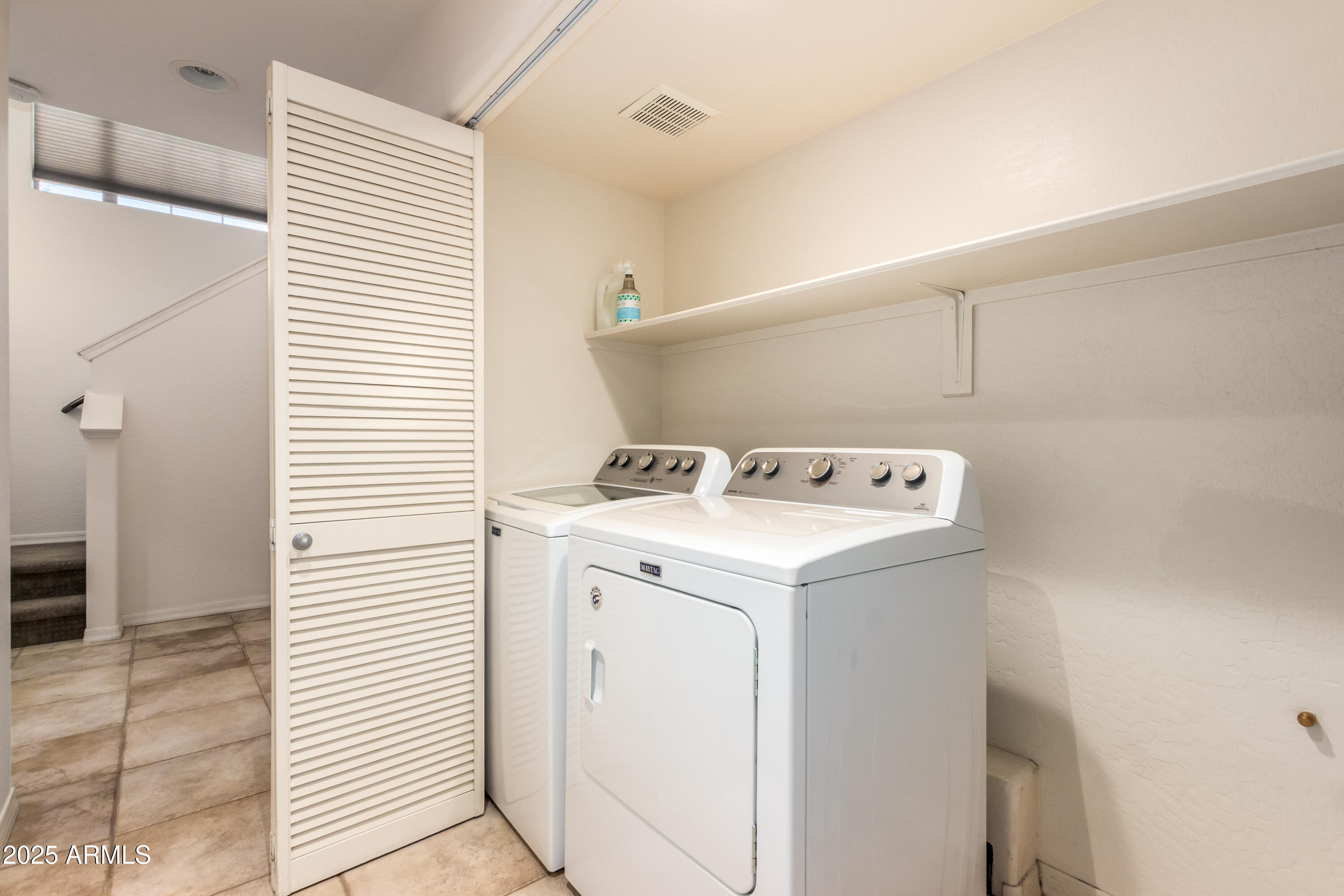6940 East Cochise Road, Unit 1016 Paradise Valley, AZ 85253 - Photo 27 of 39 a utility room with dryer and washer