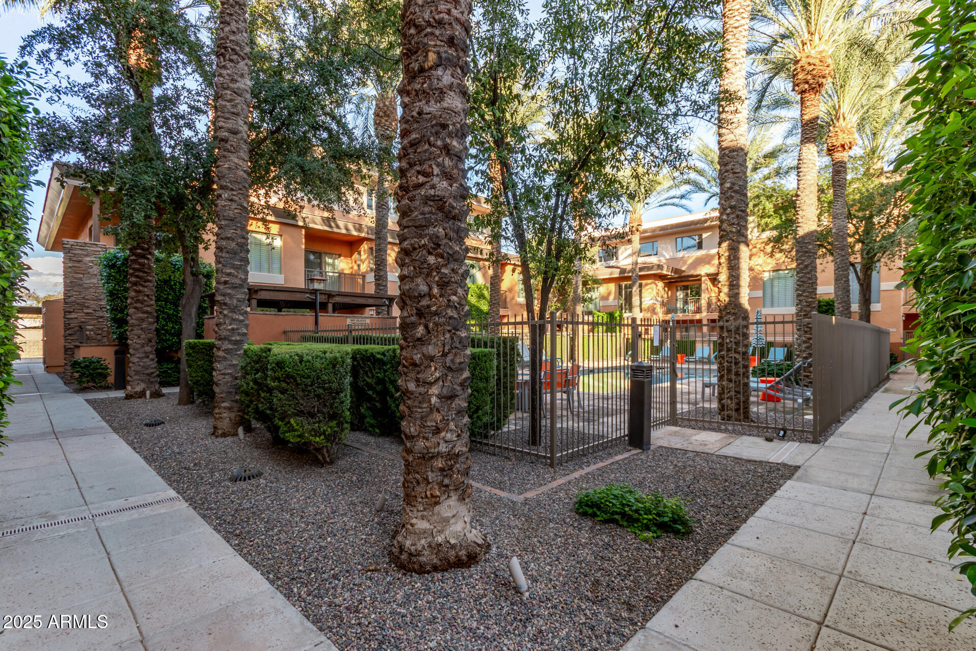 6940 East Cochise Road, Unit 1016 Paradise Valley, AZ 85253 - Photo 35 of 39 a front view of a house with garden