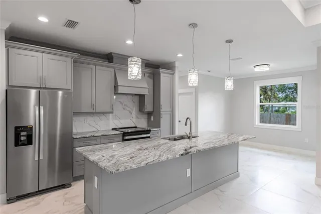 a large bathroom with a large mirror and sink