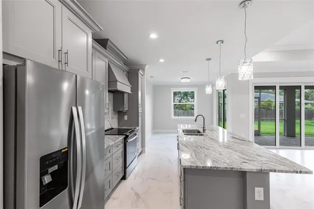 a kitchen with granite countertop cabinets and window