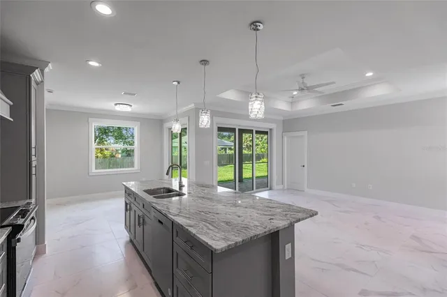 a living room with furniture a window and flat screen