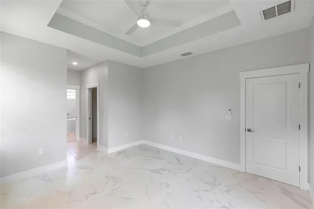a bathroom with a granite countertop sink and a bathtub