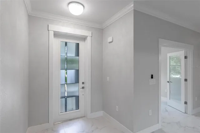 a large room with kitchen view and living room view