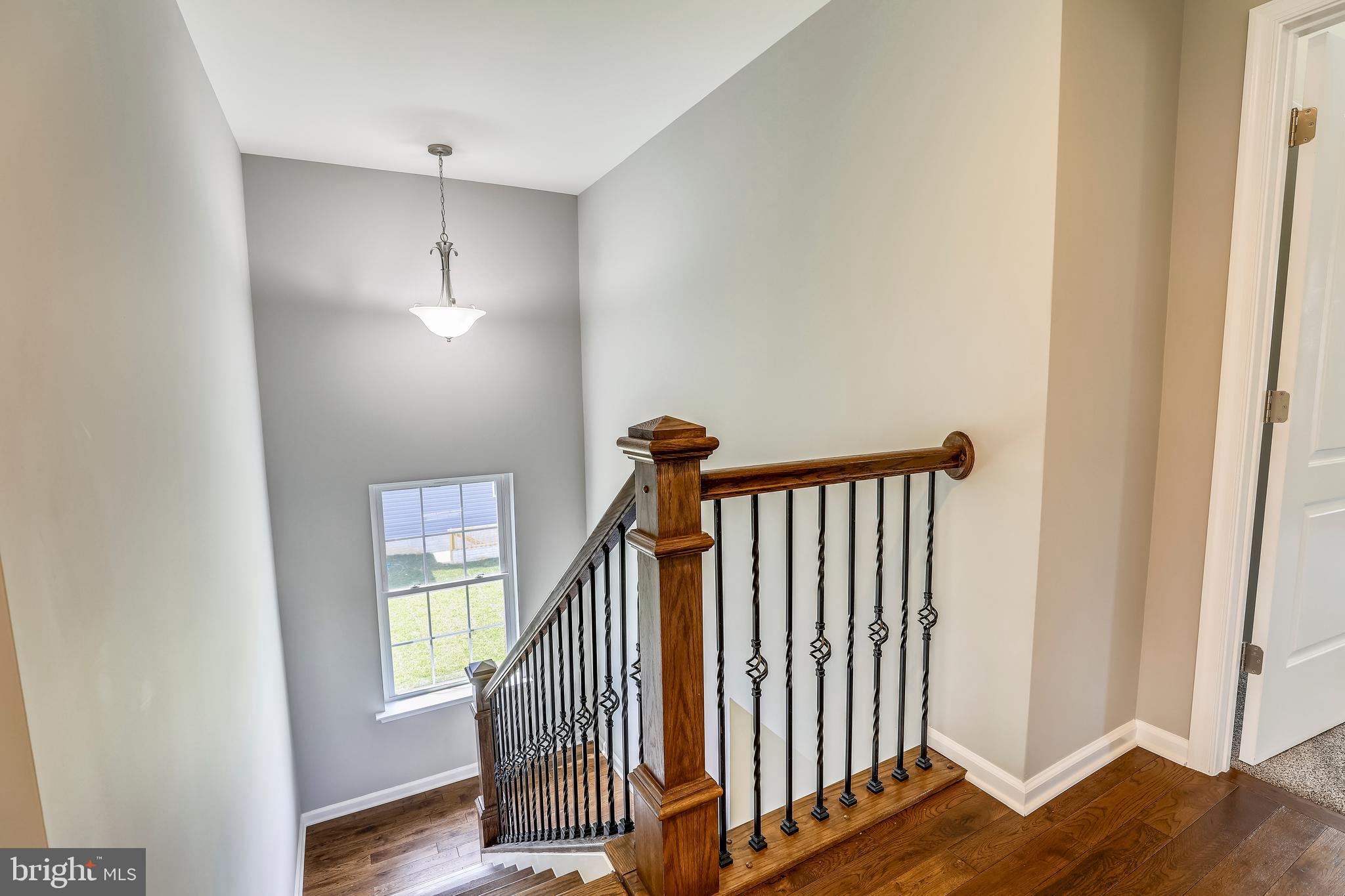 636 Powhatan Beach Road Pasadena, MD 21122 - Photo 29 of 31 HARDWOOD STAIRCASE /UPGRDE SPIRAL & WOOD RAILINGS