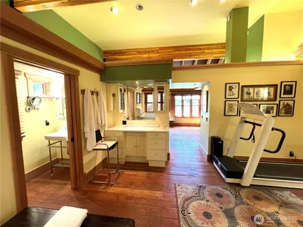 a room with lots of wooden furniture