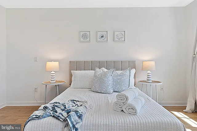 a bedroom with a bed and window