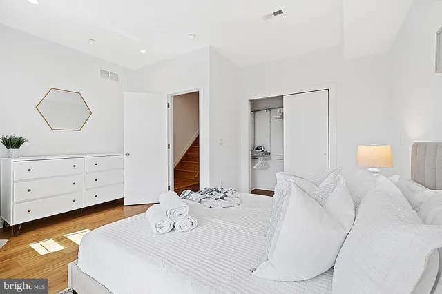 a bathroom with a bathtub sink and mirror