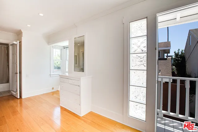 a view of front door with wooden floor