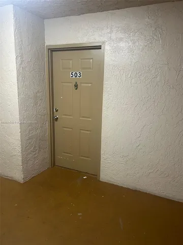 a kitchen with stainless steel appliances a refrigerator sink and stove