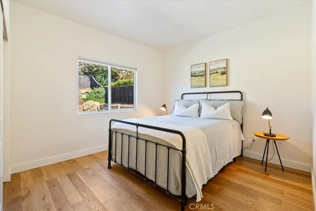 a front view of house with a garden and patio