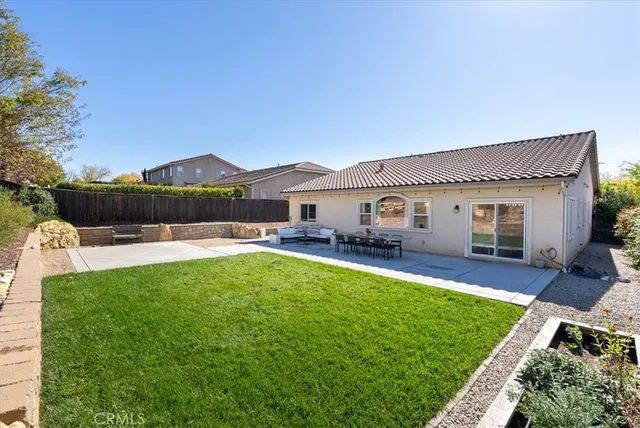a view of a patio with couches and potted plants