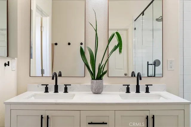 a bathroom with a sink a vanity and a mirror