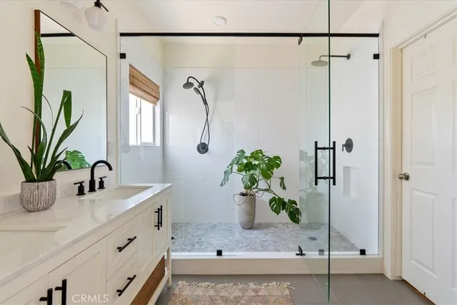 a bathroom with a potted plant