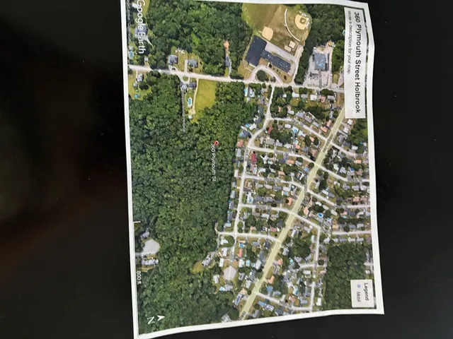 an aerial view of a yard with a lake view