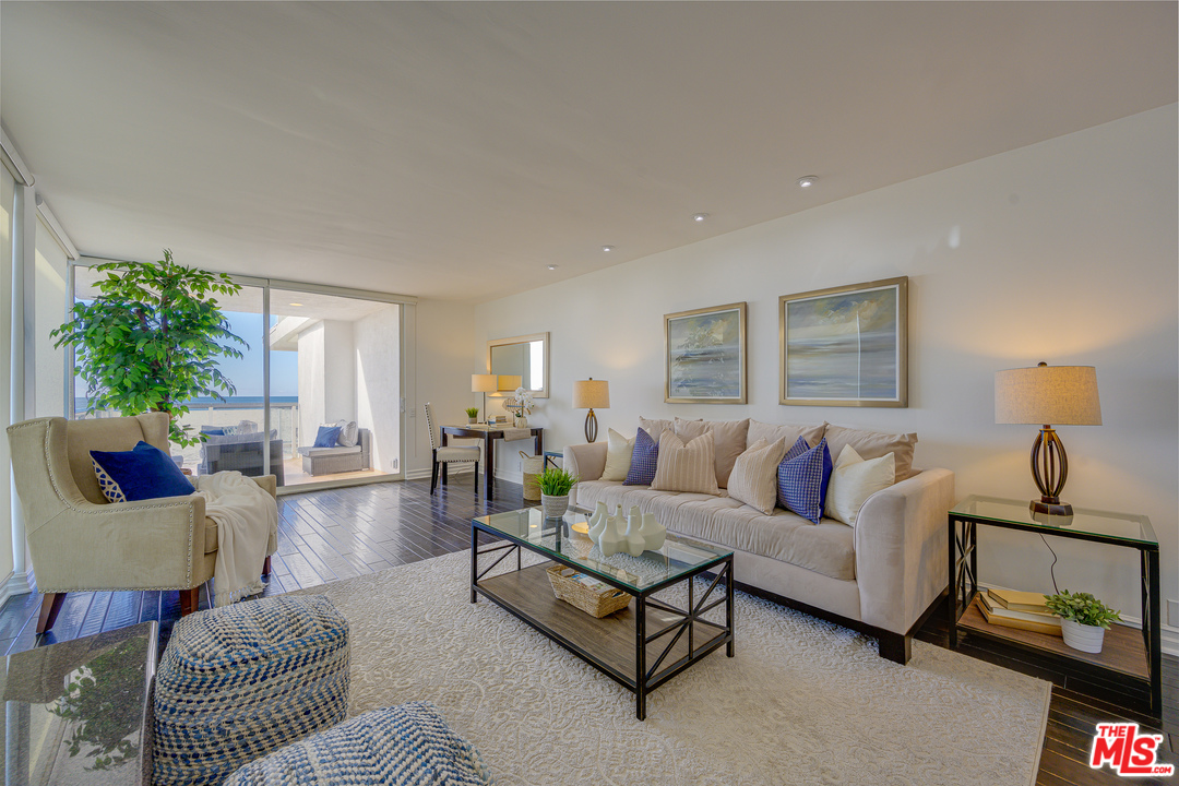 4 Quarterdeck Street, Unit 101 Marina del Rey, CA 90292 - Photo 11 of 29 a living room with furniture and a lamp